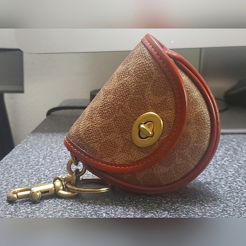 (((SOLD)))Coach Mini Saddle Turnlock Bag Charm Brass Signature Canvas Tan Rust